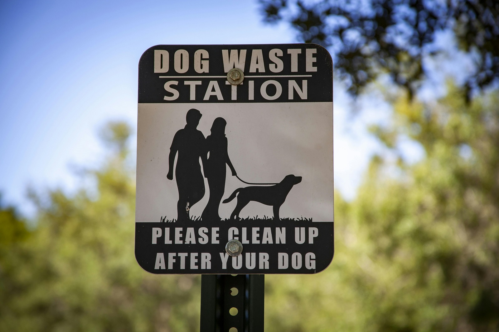 A dog waste station sign